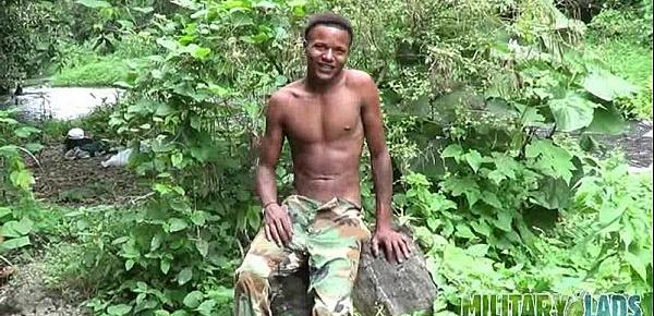  Brown soldier strips naked by the stream